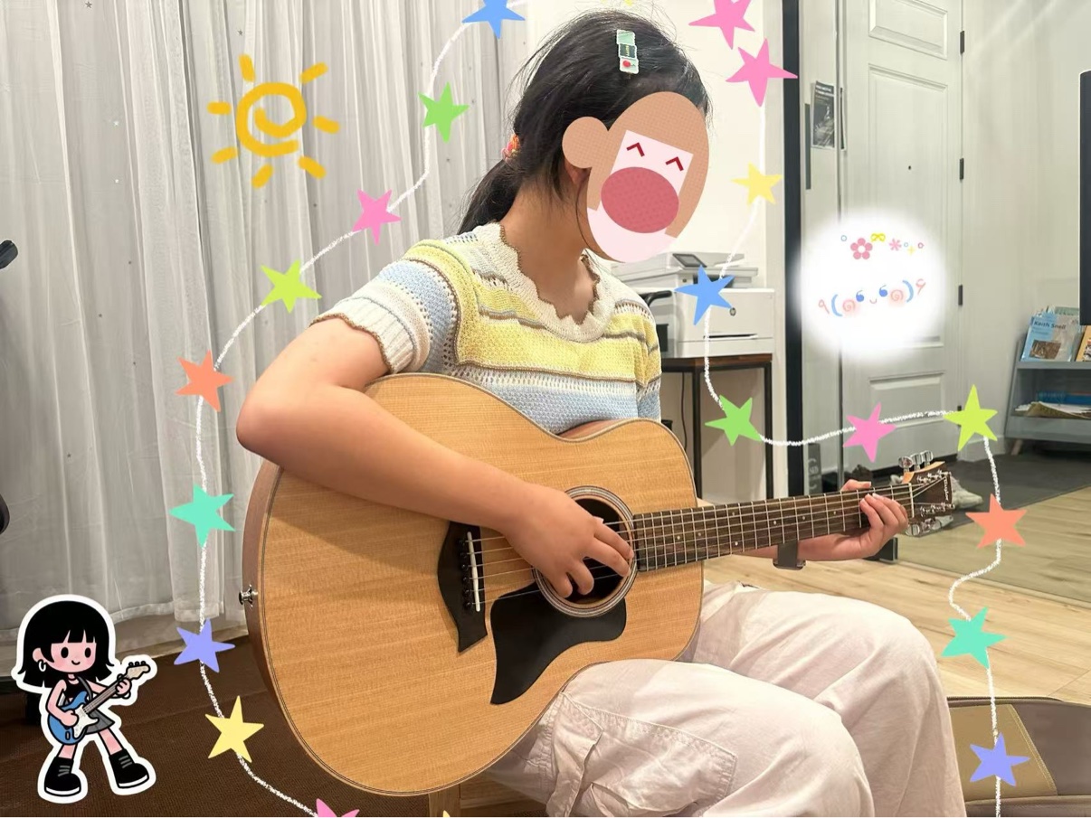 A student practicing guitar during a lesson · 学生在课堂上练习吉他